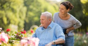 family touring senior living community with guide walking together – Heartfelt Senior Solutions blog