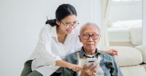 how to talk to parents about senior living adult child having conversation with elderly parent