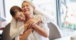 Adult daughter supporting elderly parent at home with compassion – Heartfelt Senior Solutions blog