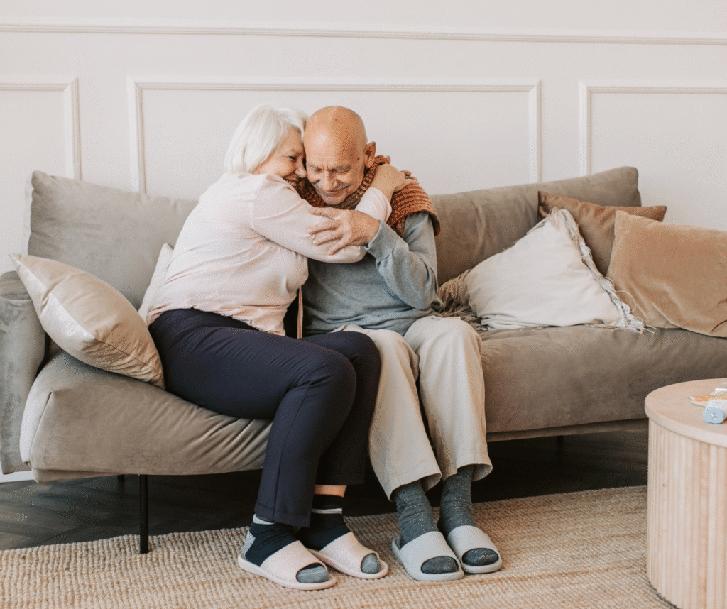 caregiver burnout fatigue tired caregiver sitting with senior parent at home