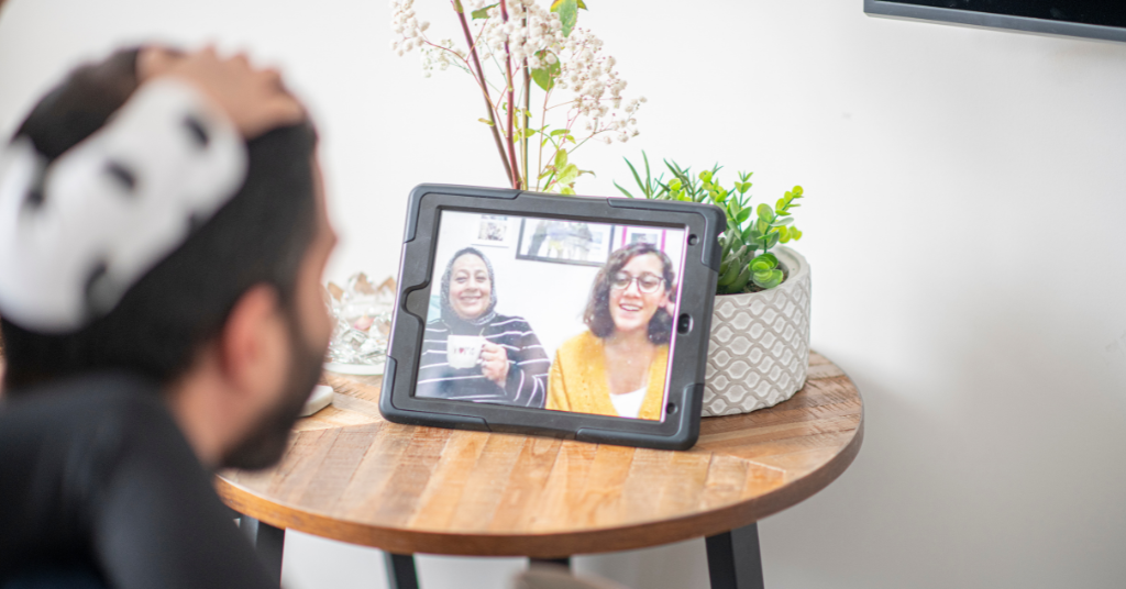 siblings discussing long-distance senior care for aging parent